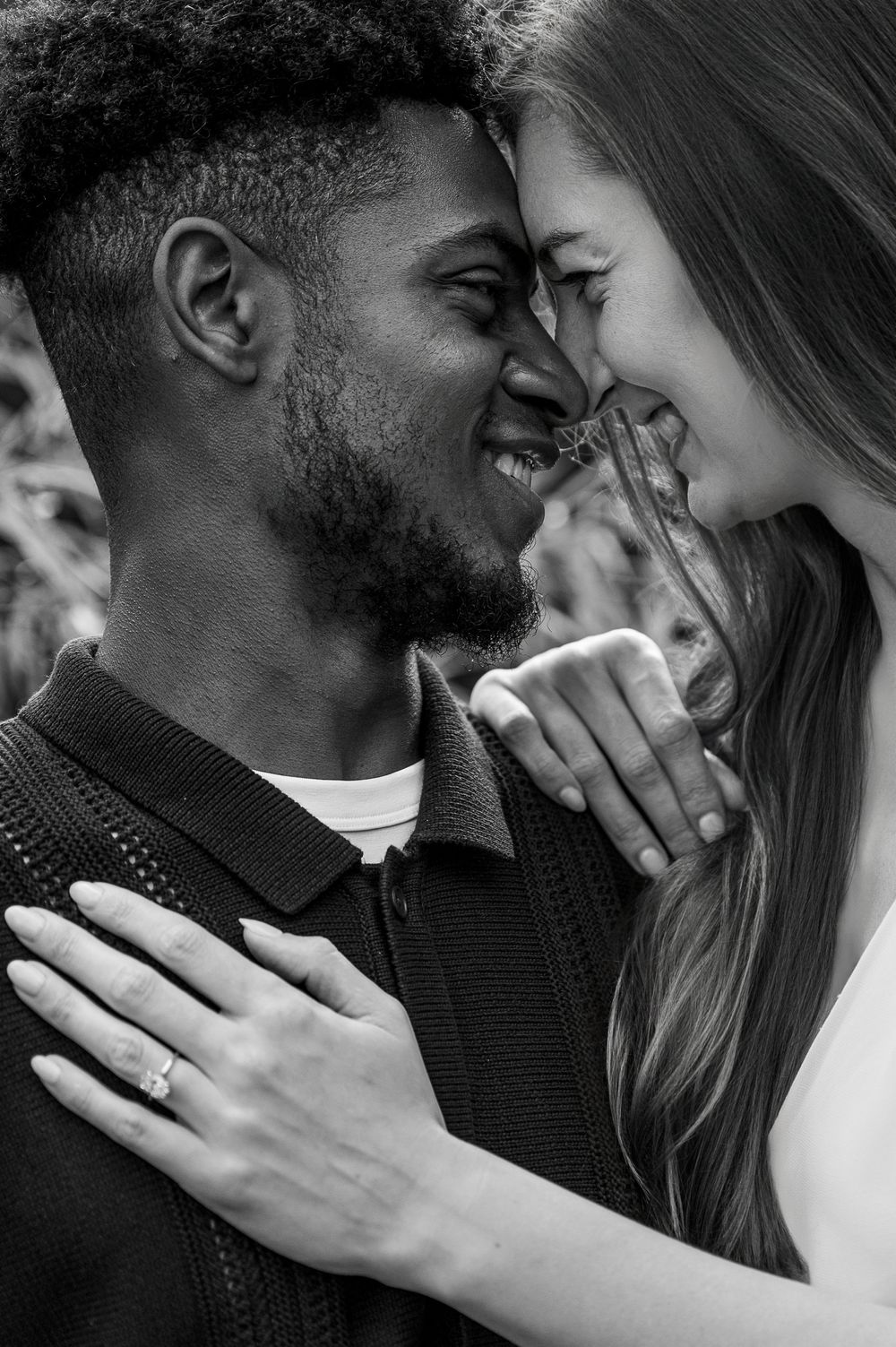 Black and white portrait series showing tender moments between a couple.