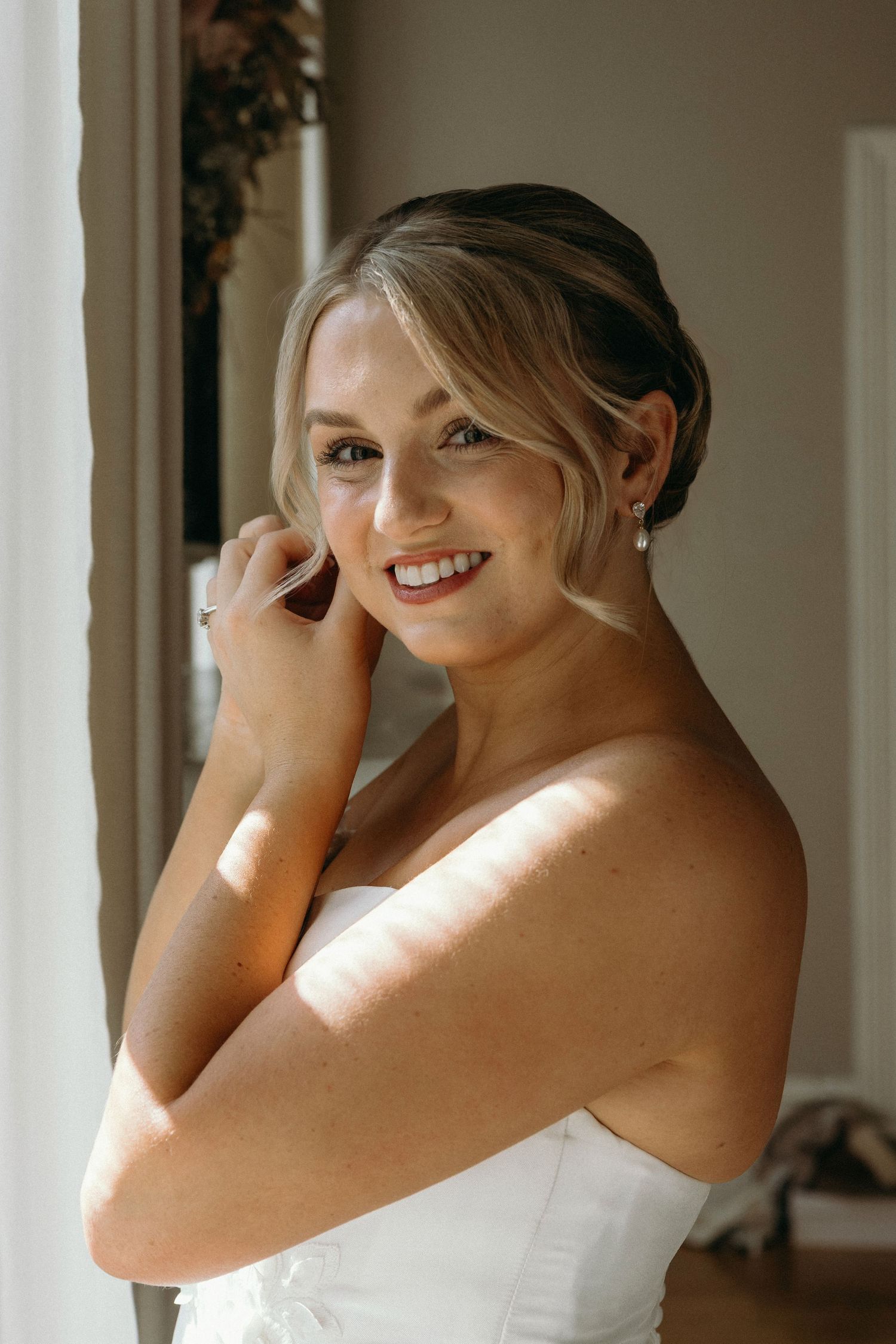 A photograph of a bride getting ready the morning of her wedding at Lillian Gardens in Newnan, Georgia