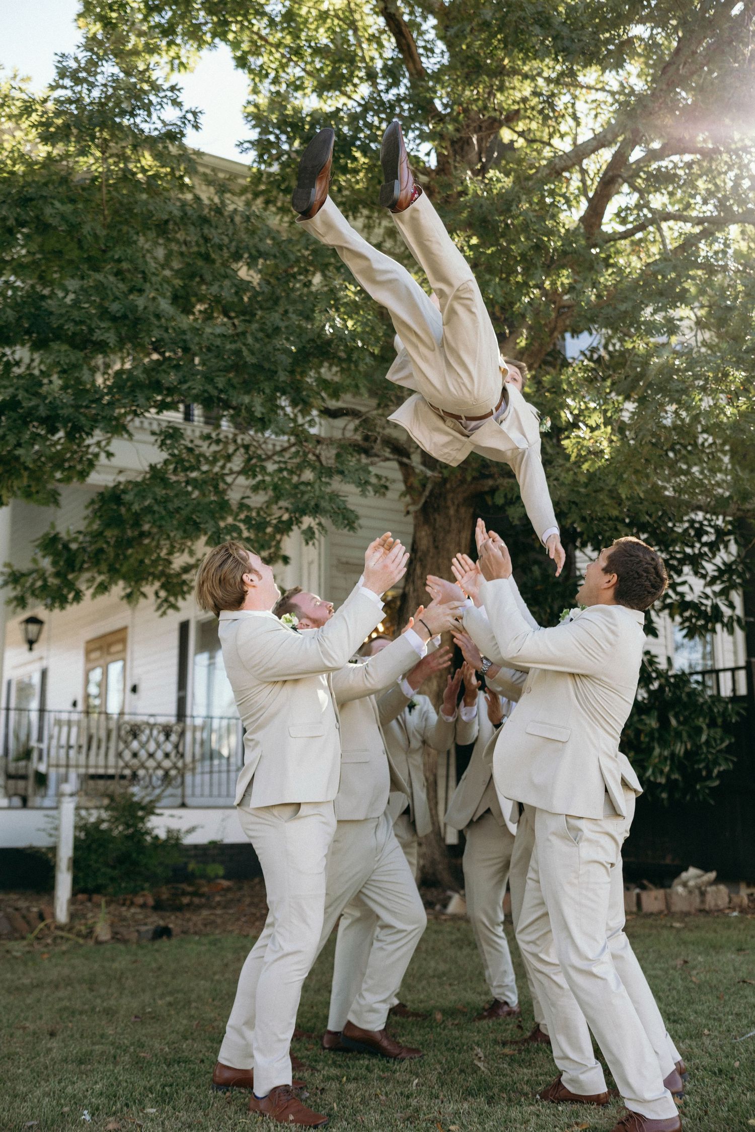 Fun groomsmen photos at Lillian Gardens in Newnan, Georgia