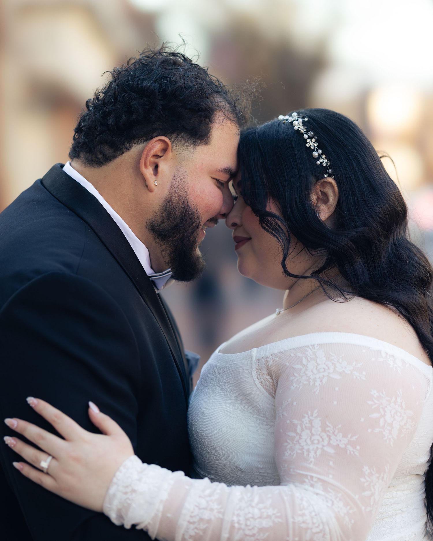 Close-up sequence of a romantic moment between newlyweds in formal attire. In downtown Annapolis