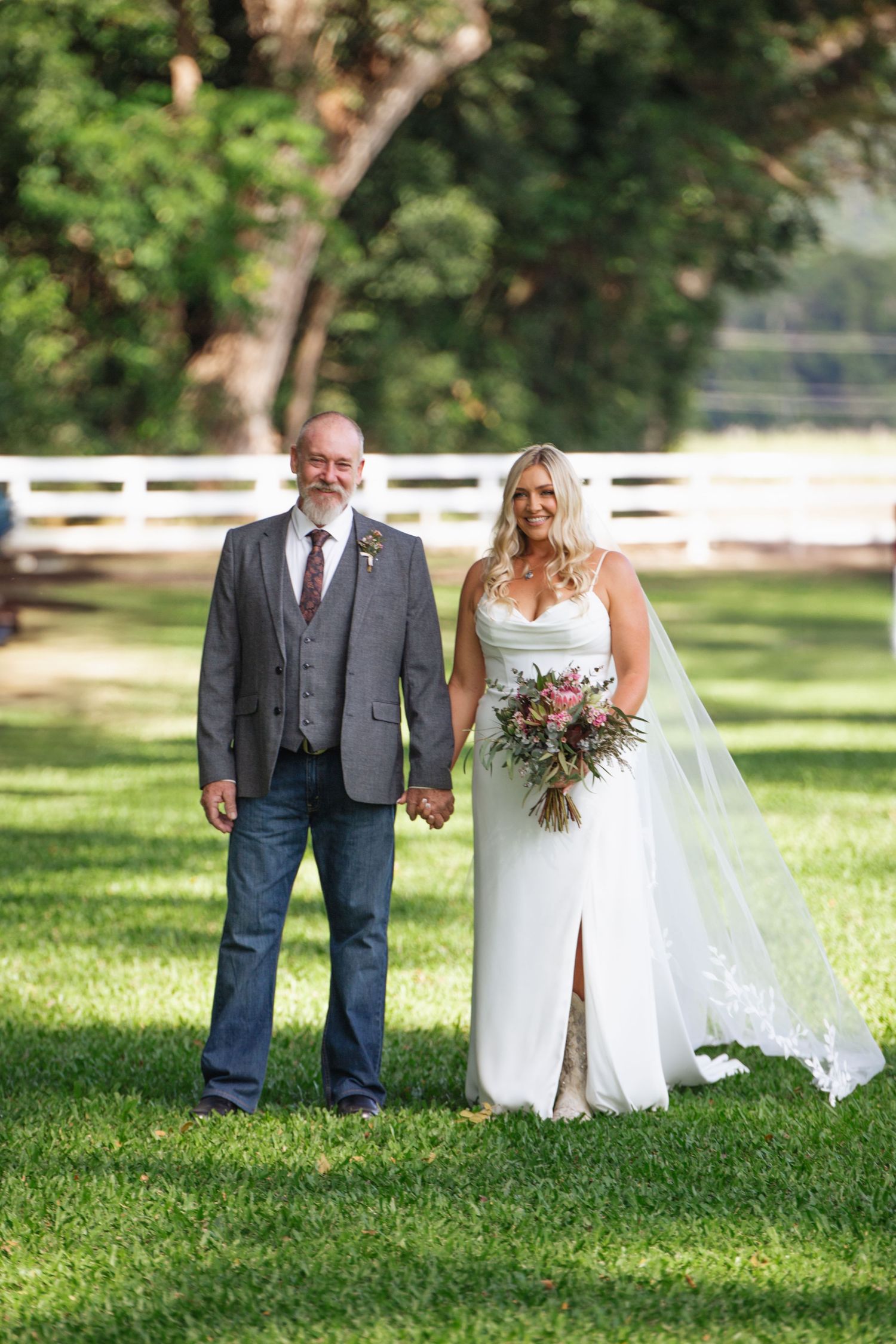 Father of the bride and bride walking down aisle at country Port Douglas Wedding