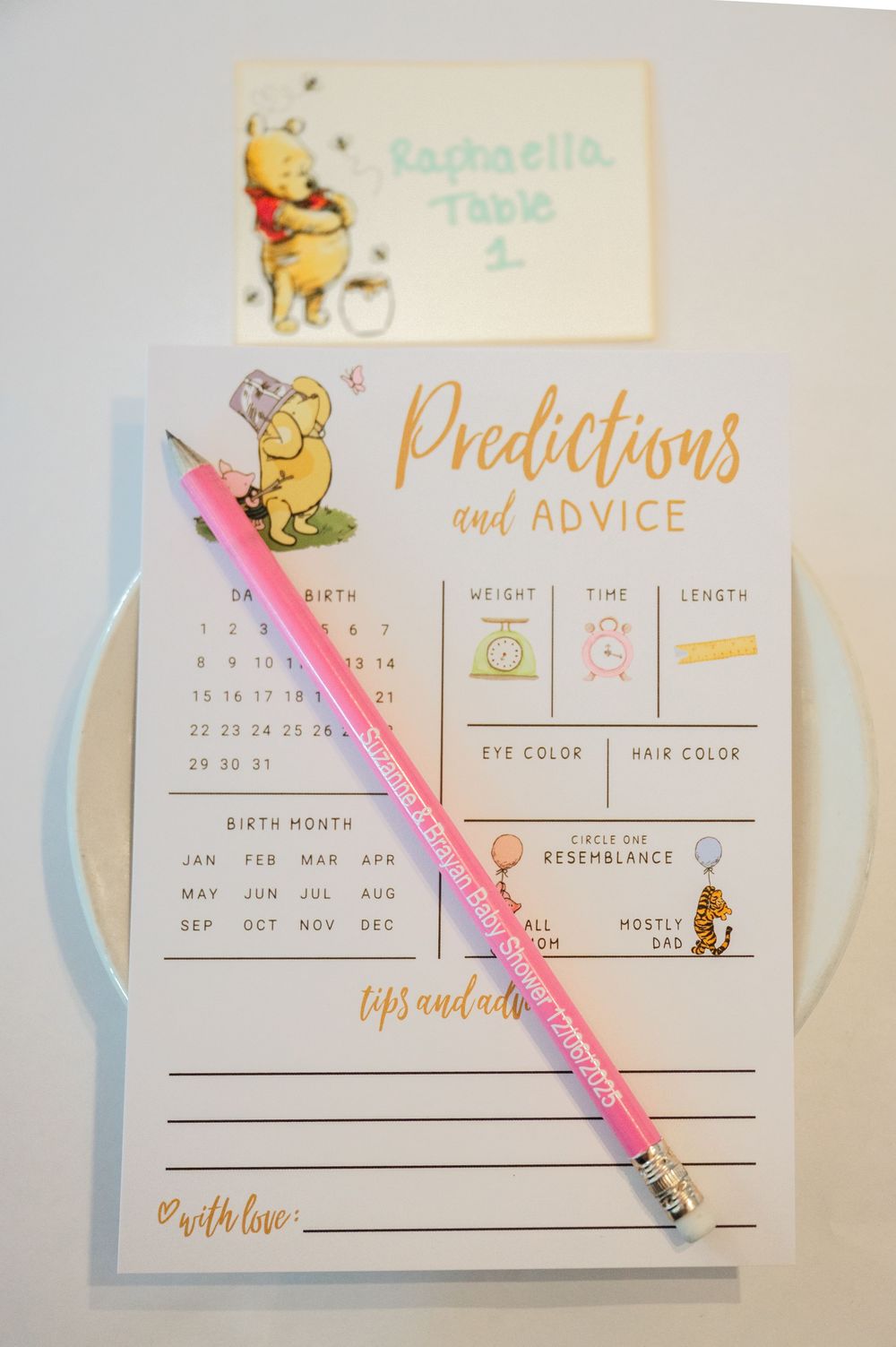 Winnie the Pooh themed baby shower prediction and advice card with a pink pencil on a white surface.
