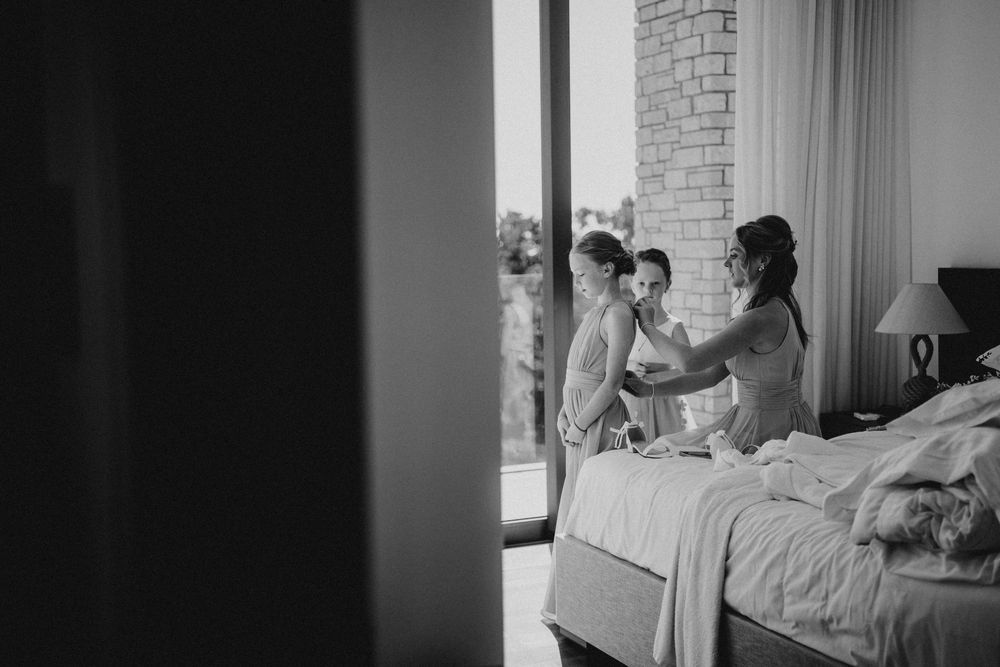 A series of six black and white photographs showing intimate moments in a hospital room with a patient and visitor.