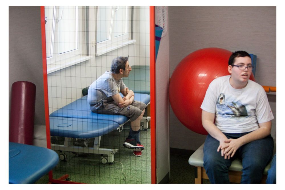 A series of images showing someone lying on a bench and rolling off onto the floor in a sequential motion.