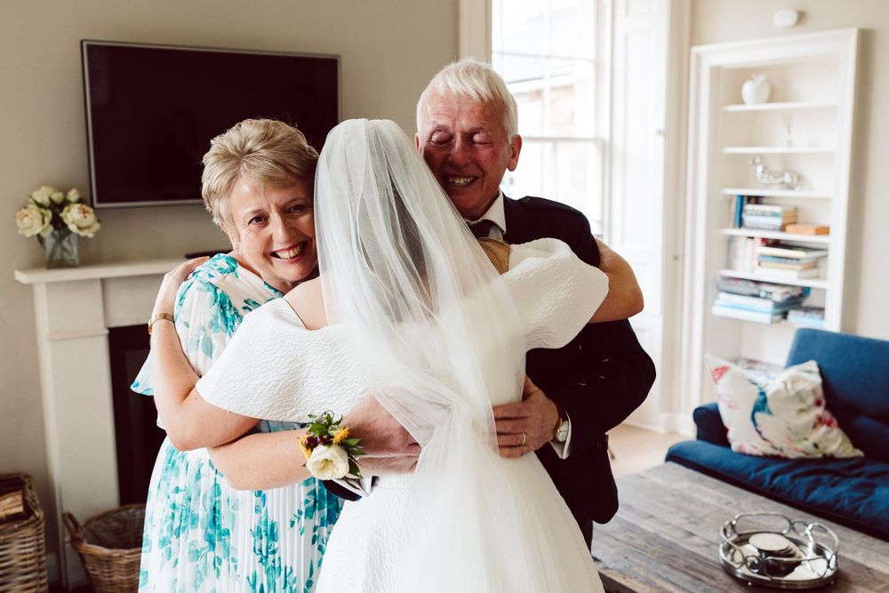A collection of candid wedding day photos showing tender embraces and special moments.