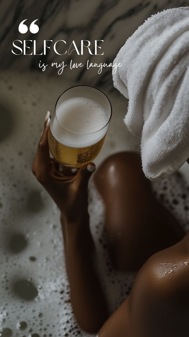 A relaxing bath scene with bubbles and a glass of beer, highlighting self-care and pampering moments.