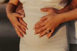 Close-up sequence of hands showing engagement ring proposal and celebration moment.