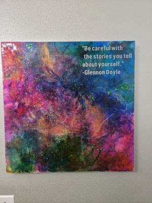 Colorful galaxy-inspired artwork with a quote from Glennon Doyle about being careful with self-stories.