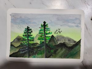 Watercolor painting of mountain landscape with evergreen trees against a misty sky.