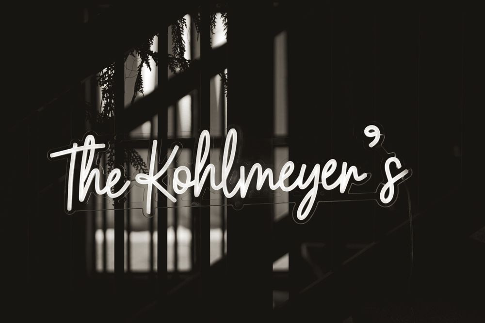 Black and white artistic wedding venue signage.