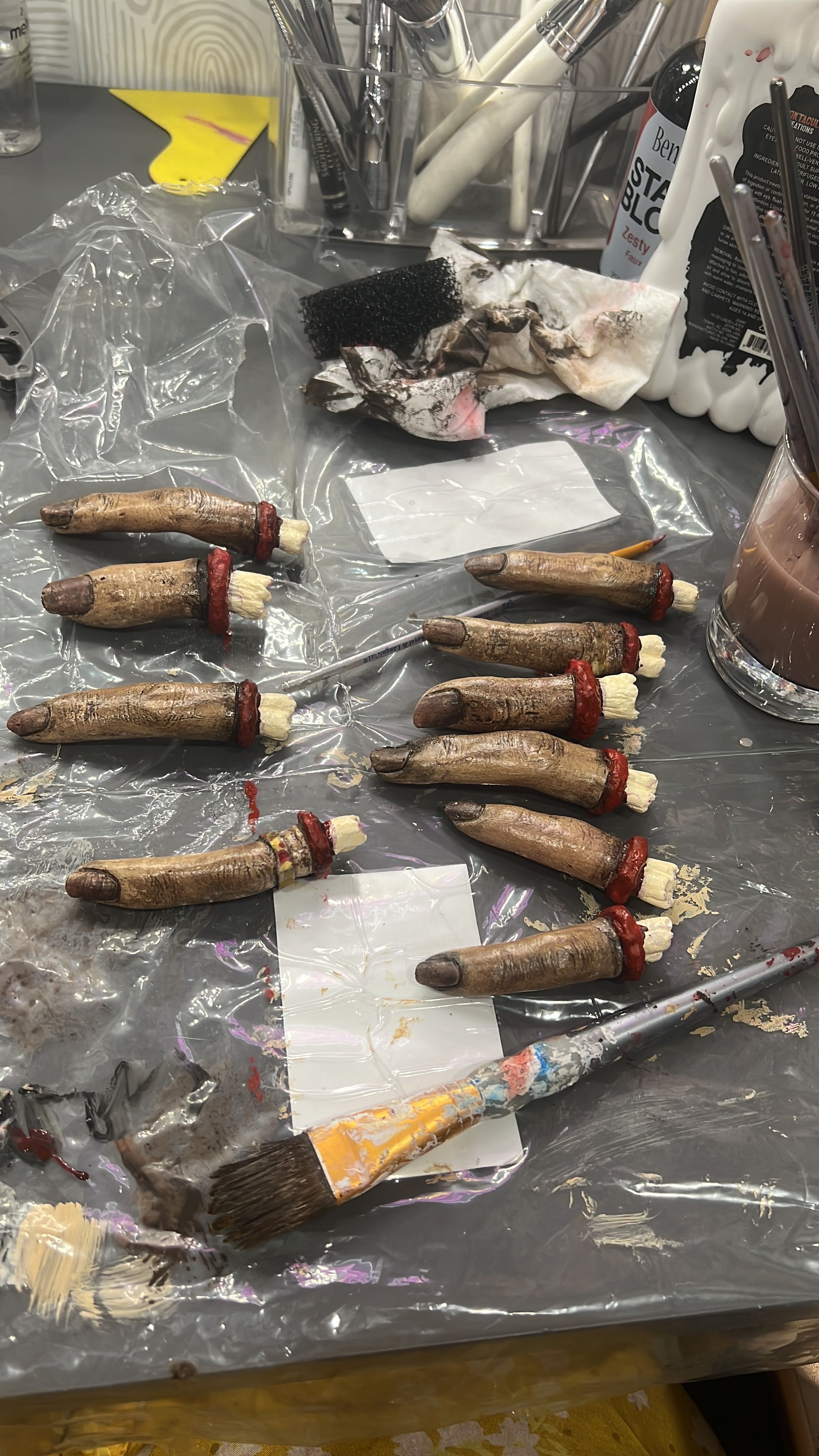 fingers hands painted to look dead props horror movie.