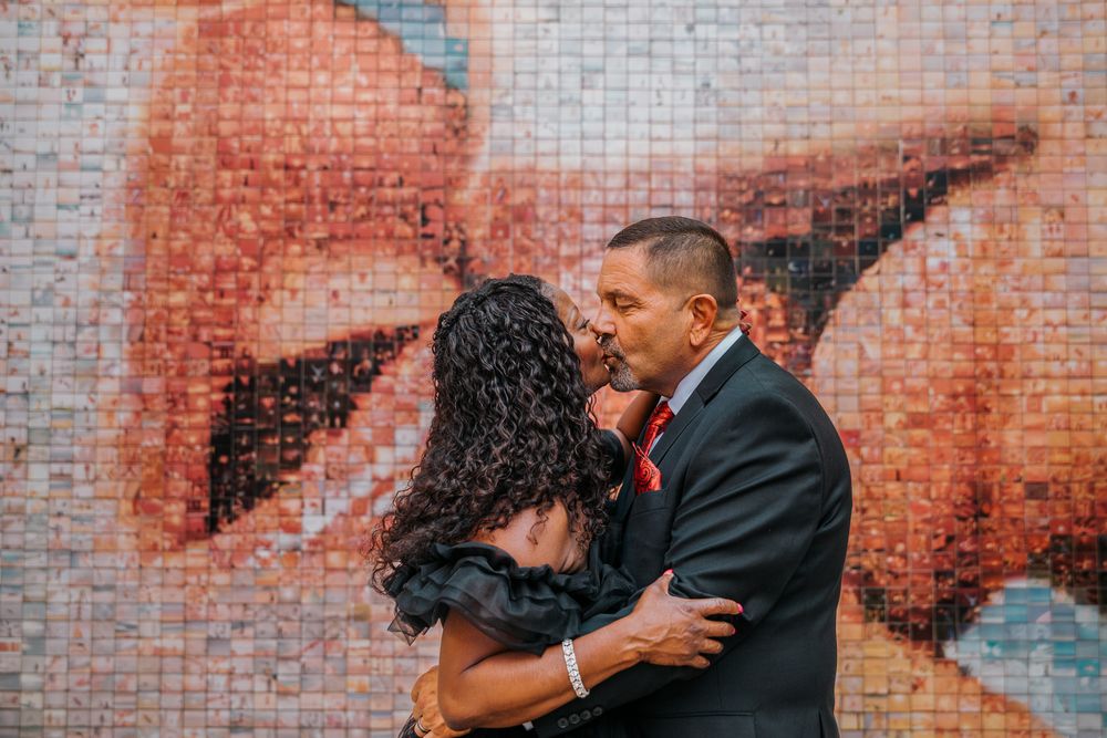 Shane kissing Johnine's forehead in Old City side street