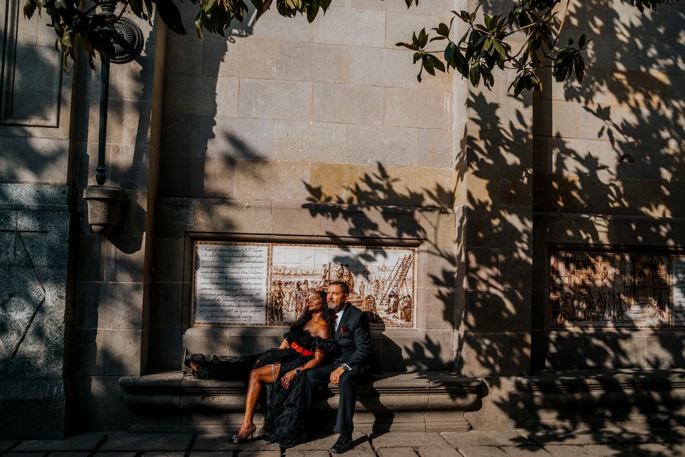 Anniversary photo near colorful tiled Catalan wall