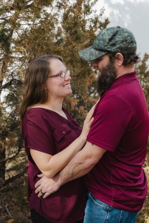 The Cox family shares smiles and sweet moments during a joyful photo session, capturing love, laughter, and togetherness.