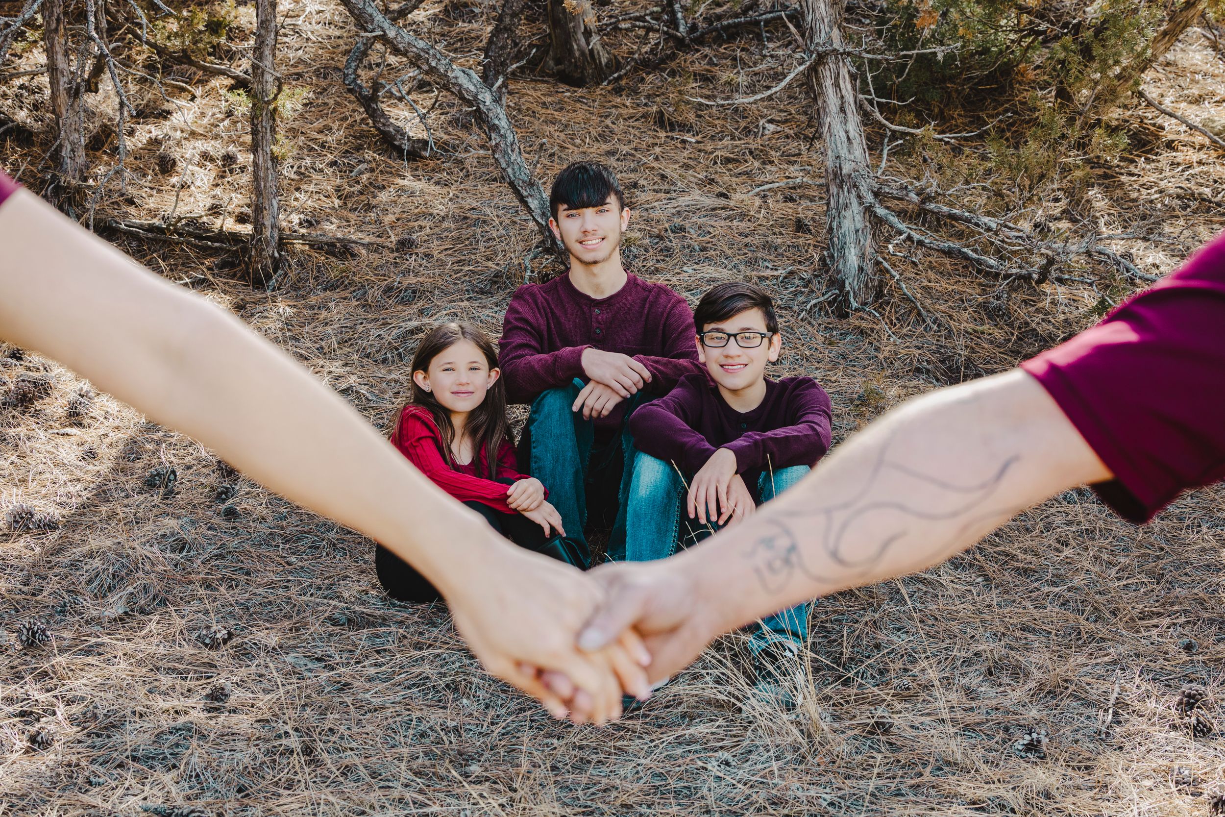 The Cox family shares smiles and sweet moments during a joyful photo session, capturing love, laughter, and togetherness.