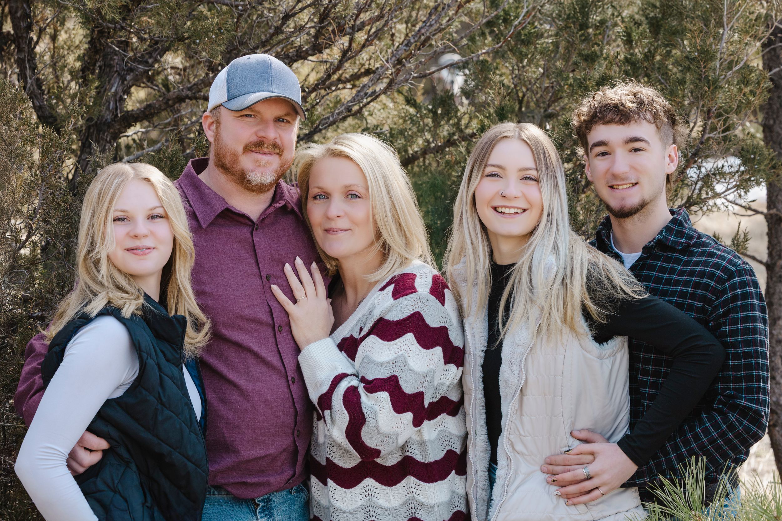 The Acords share smiles and sweet moments during a joyful photo session, capturing love, laughter, and their special bond.