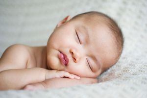 Newborn baby resting on a soft, textured blanket during a Toronto newborn session by Phoebe Lee Photo