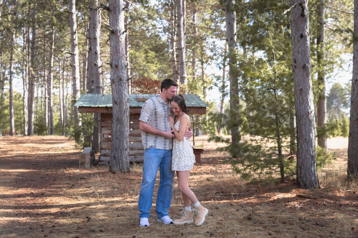 portrait of a young couple during their engagement hugging each other
