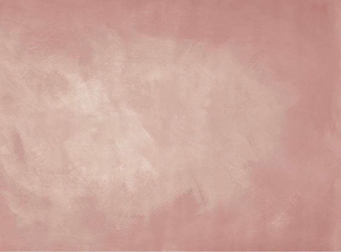 Abstract textured background in dusty rose pink with cloudy effect.