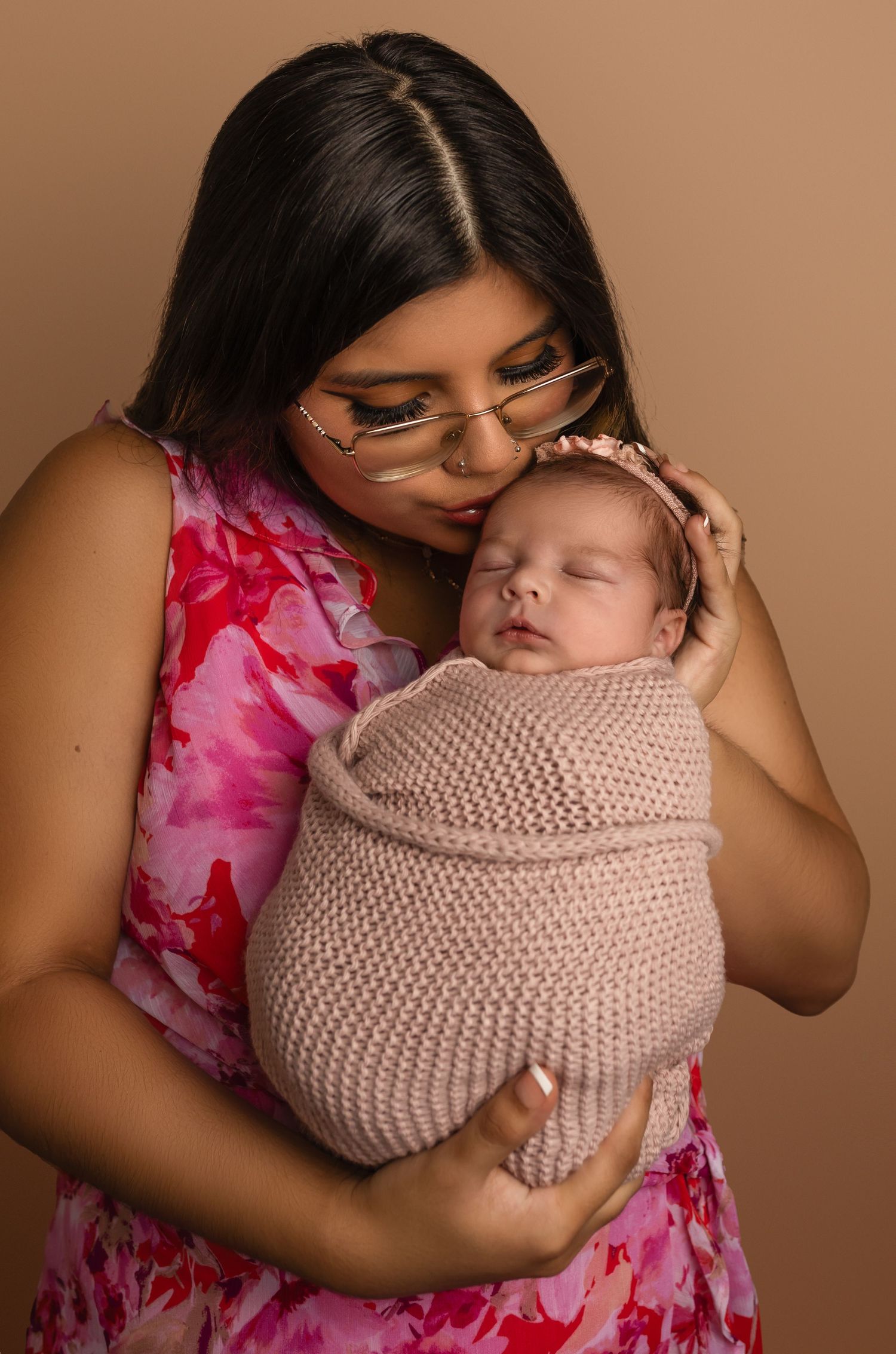 Charlottesville newborn, newborn, maternity, baby, family, mom in pink dress kissing wrapped baby girl with headband
