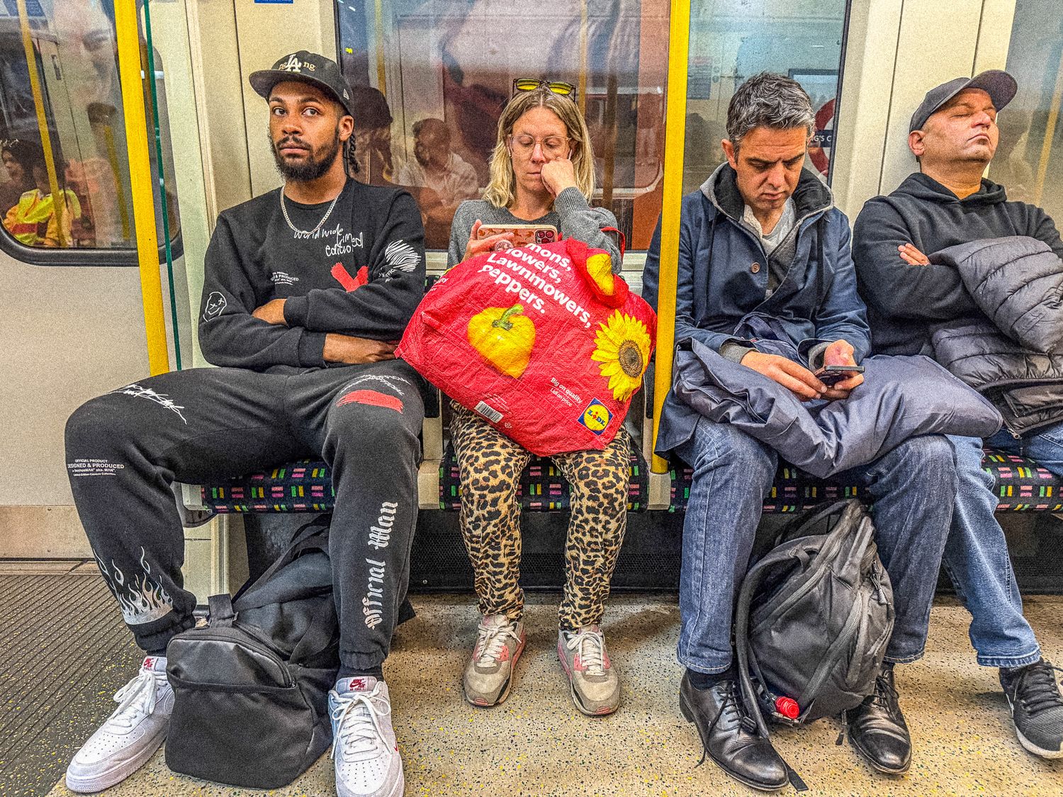 Urban moment on the Tube with passengers in motion – London street photo by Emma Drohan
