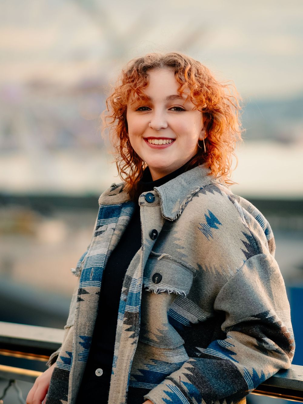Multiple cropped shots of someone in a denim jacket with curly ginger hair posing against a blurred background.