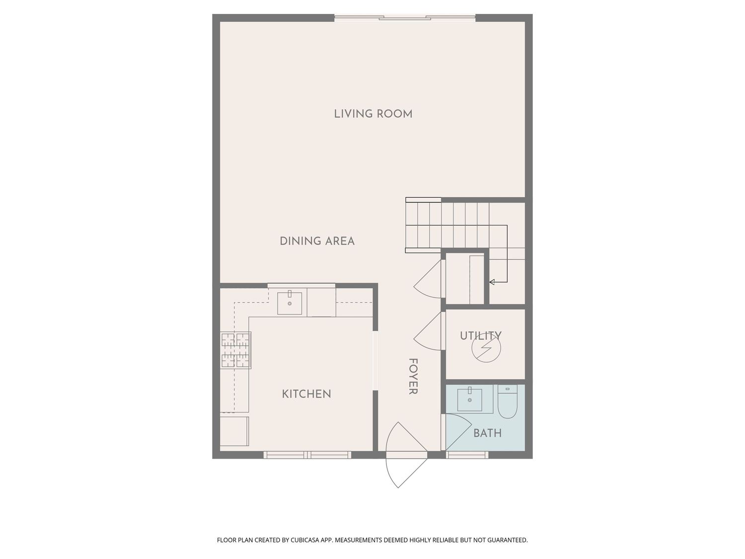 Floor plan showing open living room, dining area, kitchen, utility room, and bathroom layout for a modern apartment.