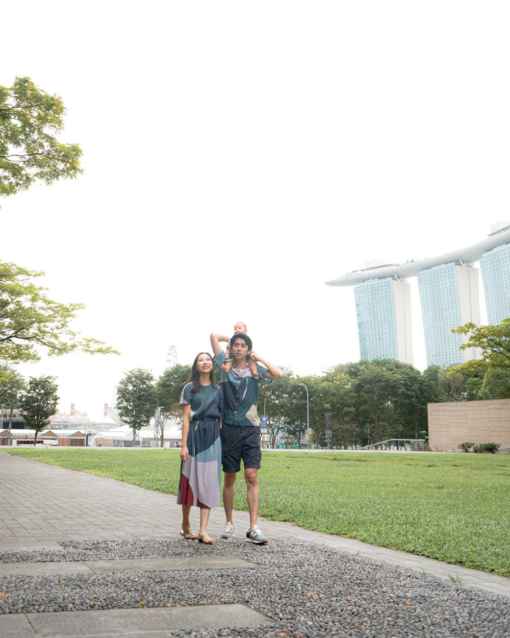 Happy moment captured at Marina Bay Gardens with iconic Singapore skyline.