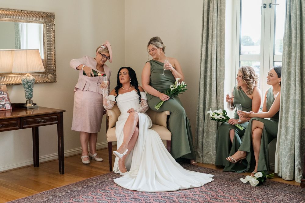 A collage of wedding preparation moments showing a bride getting ready with bridesmaids in sage green dresses.