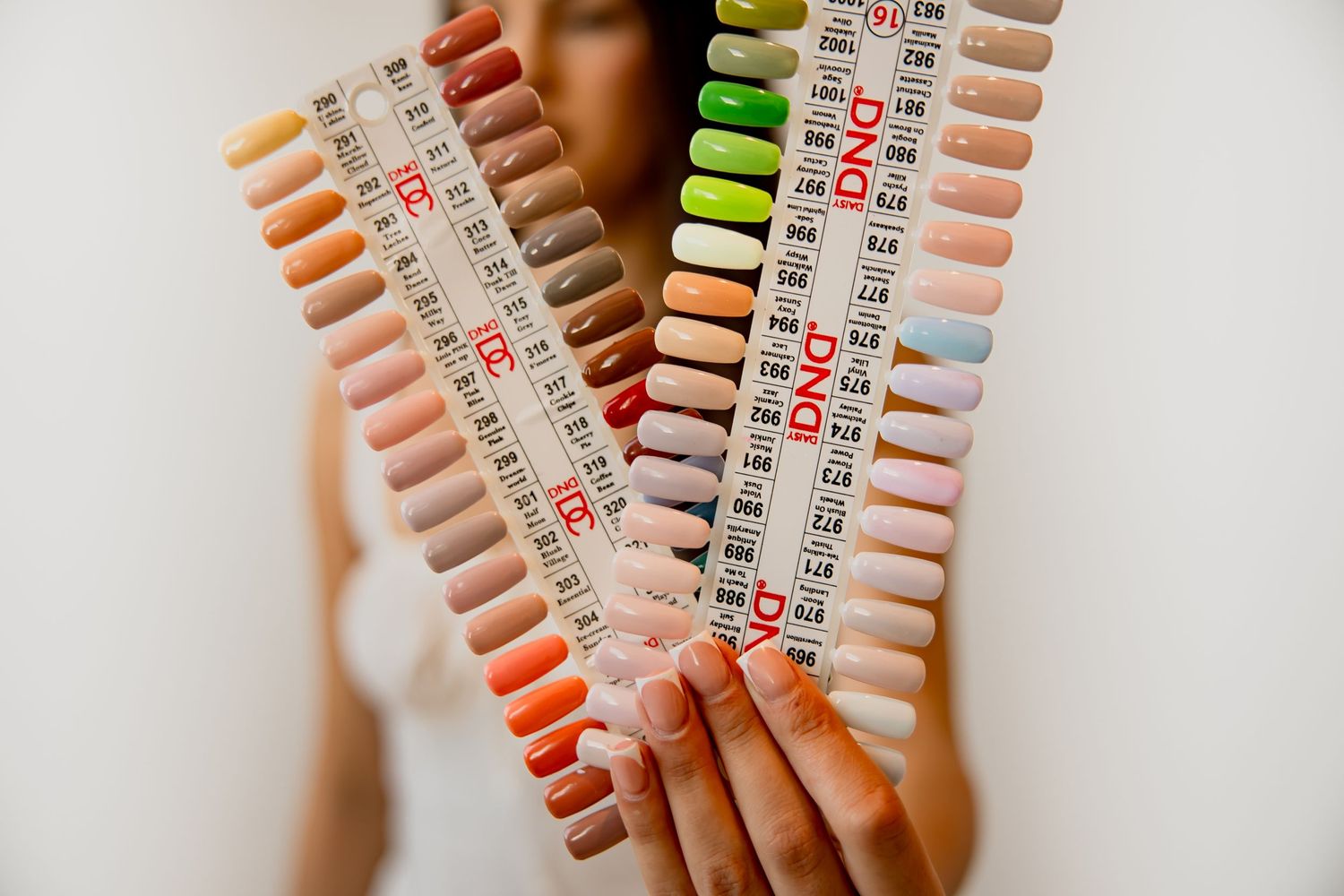 Color swatch display of nail polish samples arranged in rows showing various shades.