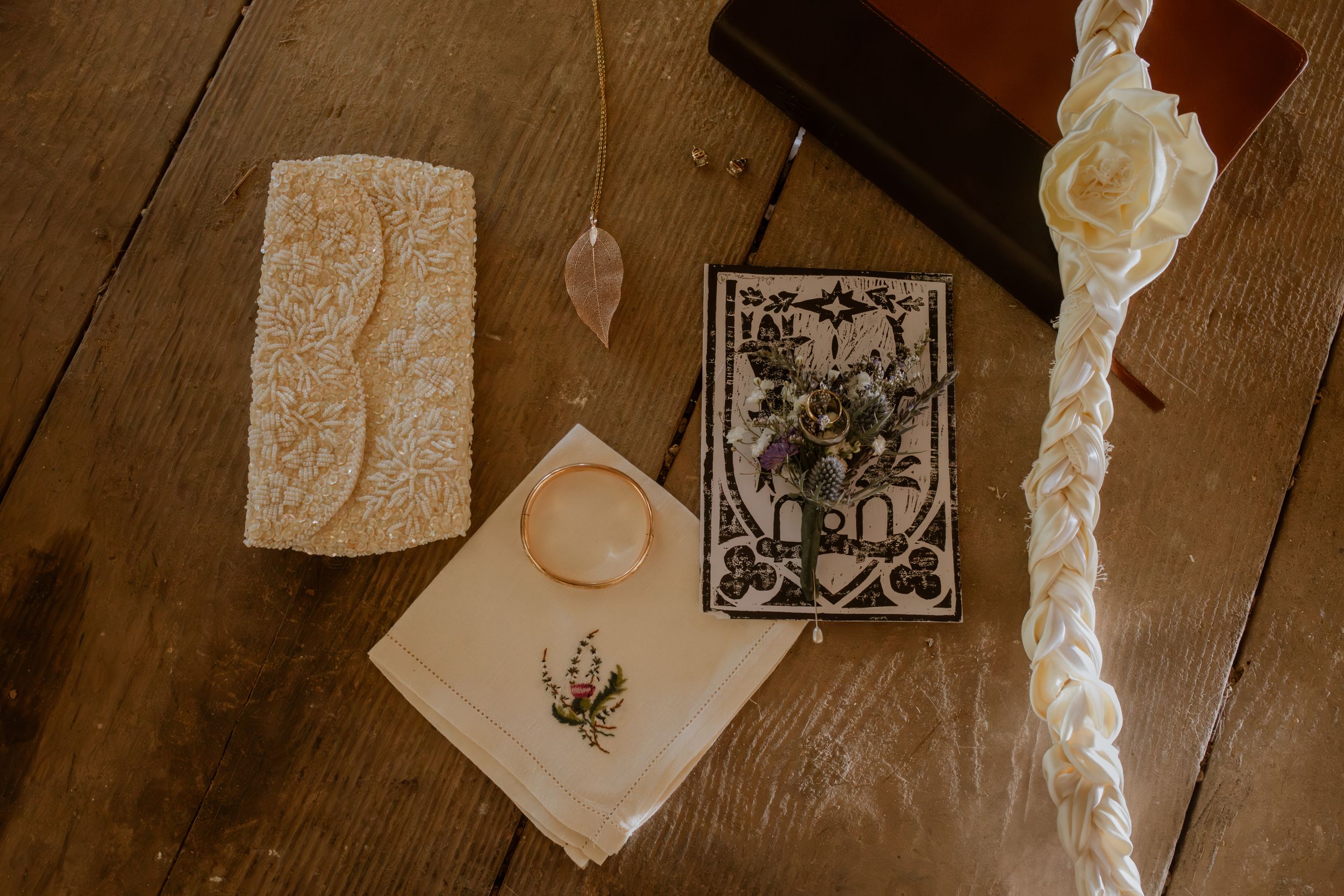 Artistic paper decorations and photos hang from wooden beams creating a romantic atmosphere.