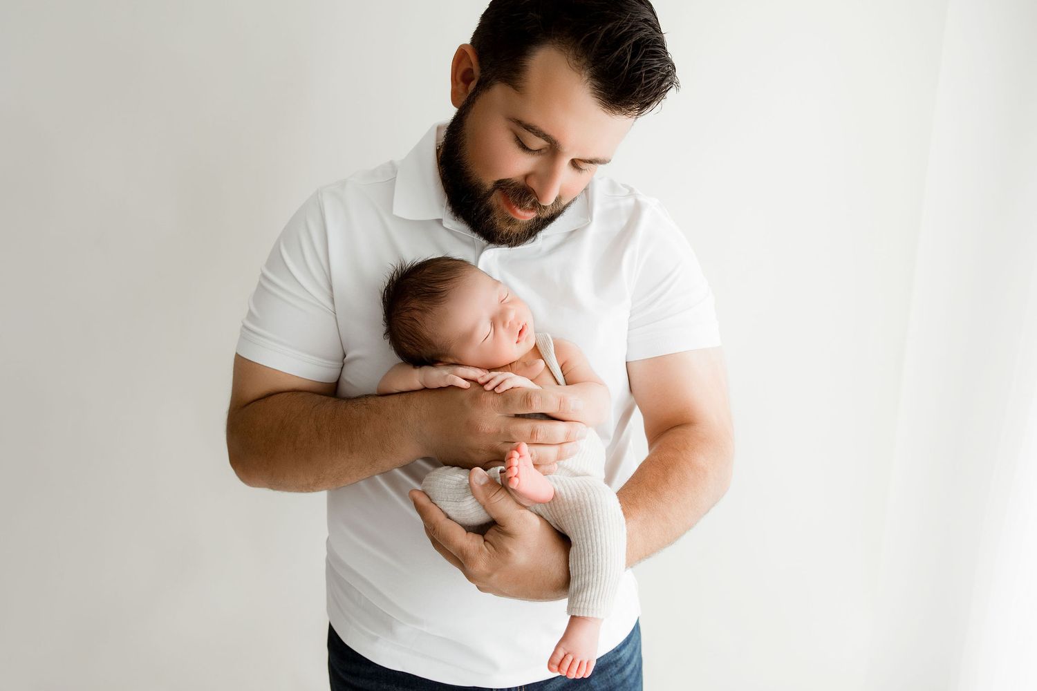 Father looking at his newborn son