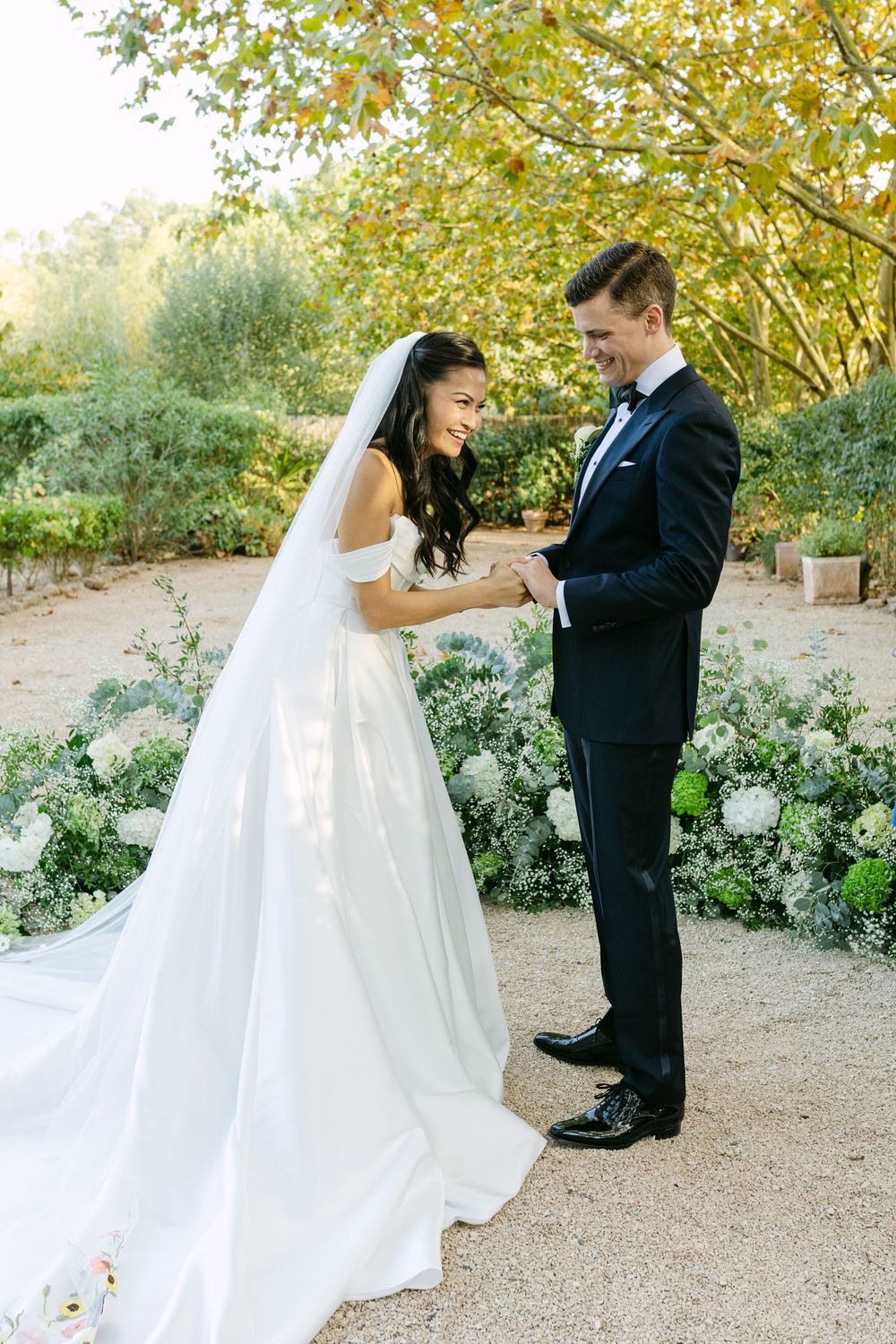 Bride and groom laughing together during outdoor wedding ceremony at Quinta Nova do Hespanhol Lisbon