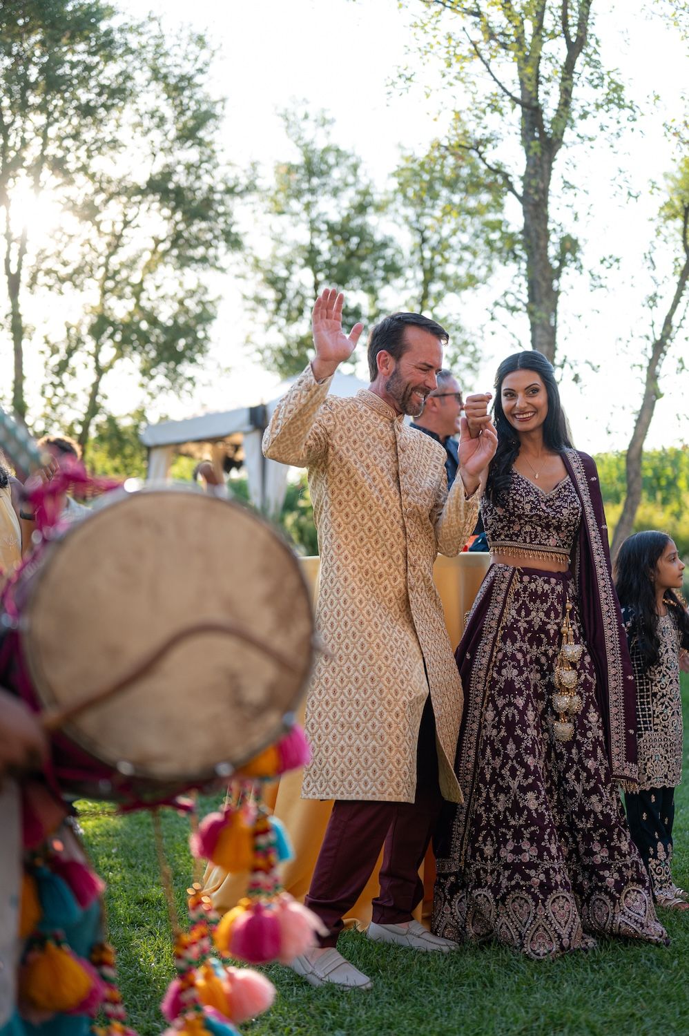 A traditional Dhol player performing in the vineyards of Lake Garda for an Indian celebration