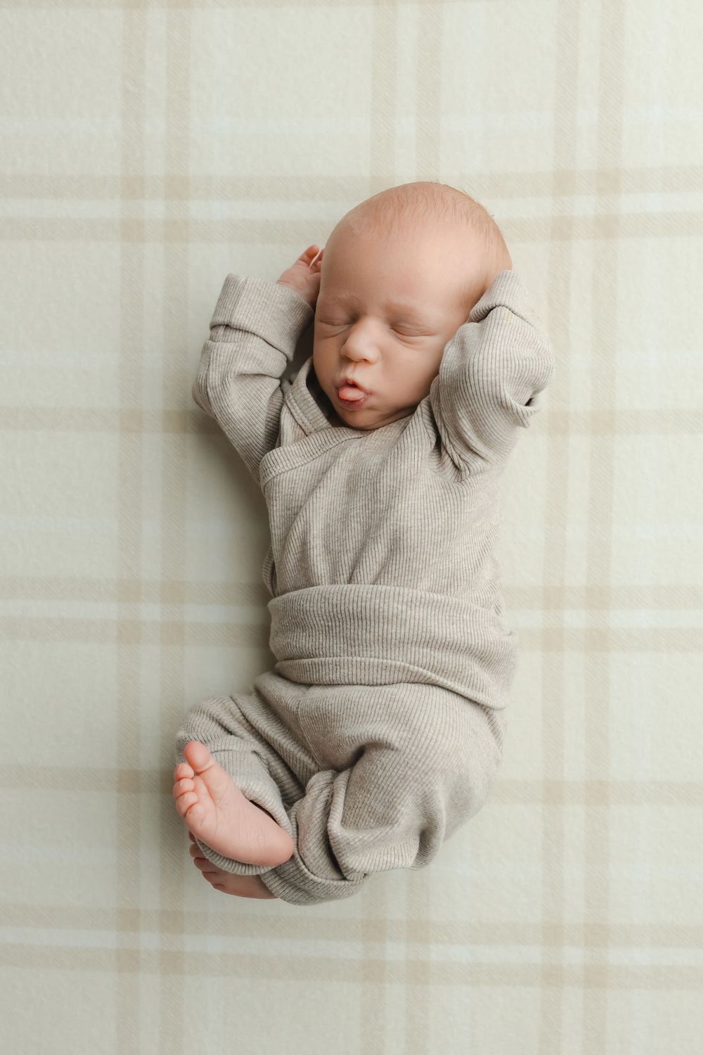 Twin newborn boys on plaid background, taken by Jen Knightstep, Photographer