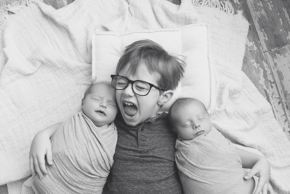 Twin newborns with big brother, taken by Jen Knightstep, Photographer