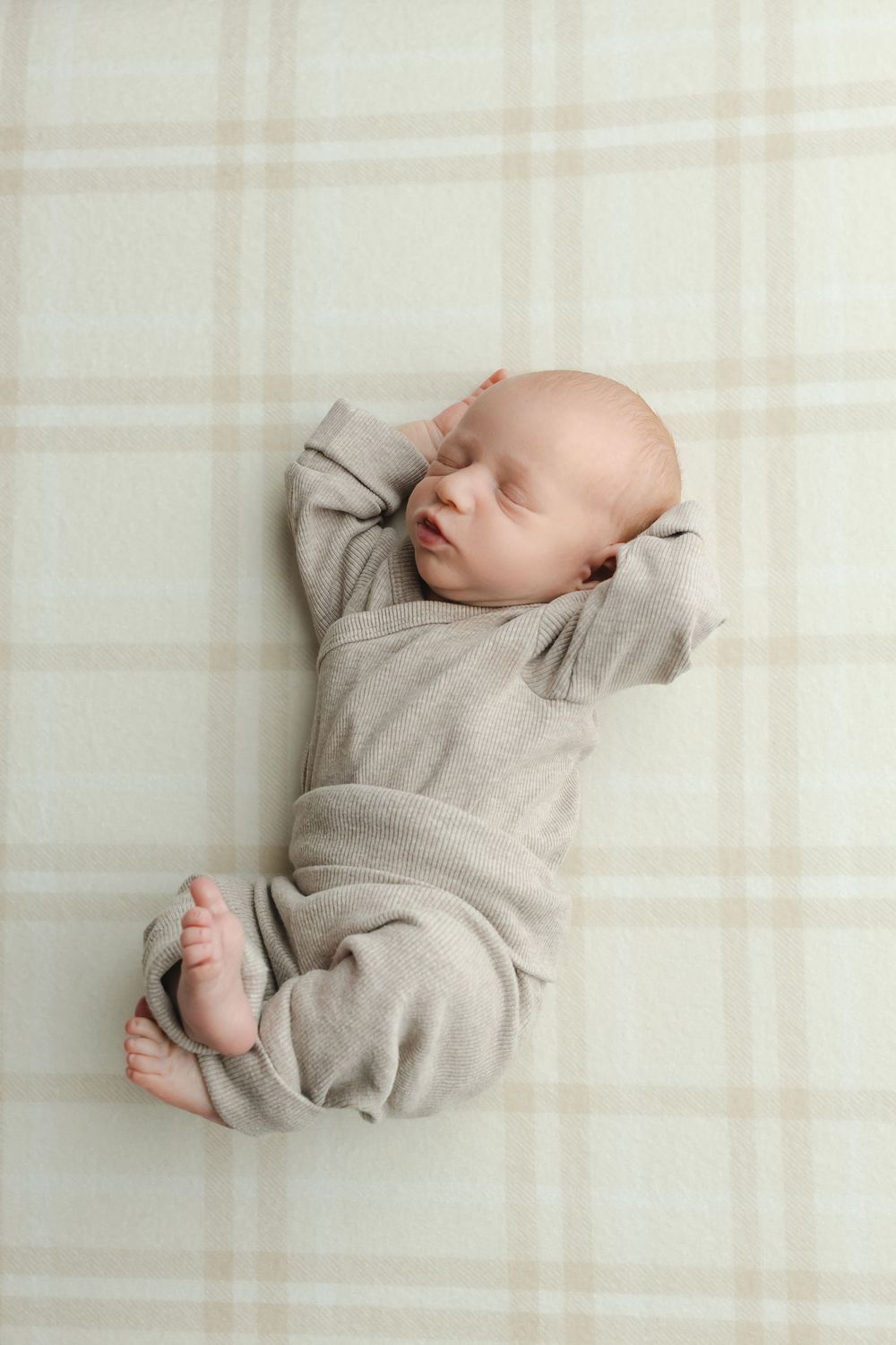 Twin newborn boys on plaid background, taken by Jen Knightstep, Photographer
