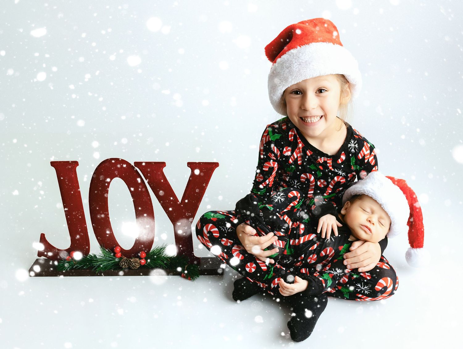 A big brother holding a newborn baby brother. - Greenville, SC newborn photographer - Easley, SC newborn photographer.