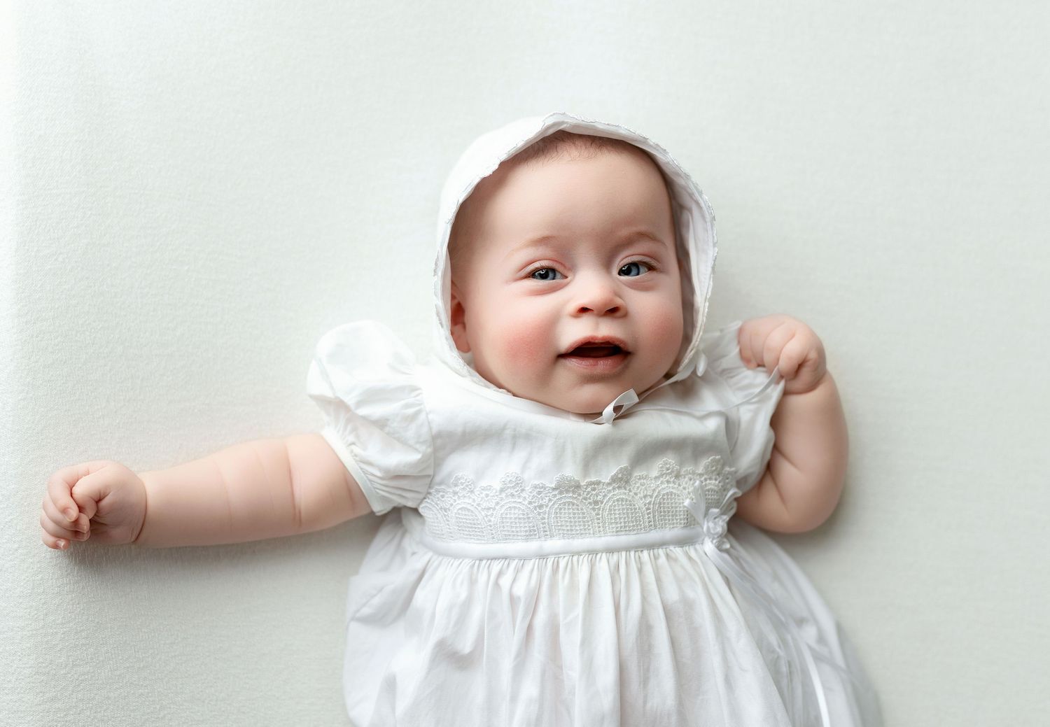 A baby in white dress. Greenville SC newborn photographer, Easley SC newborn photographer, Upstate newborn photographer