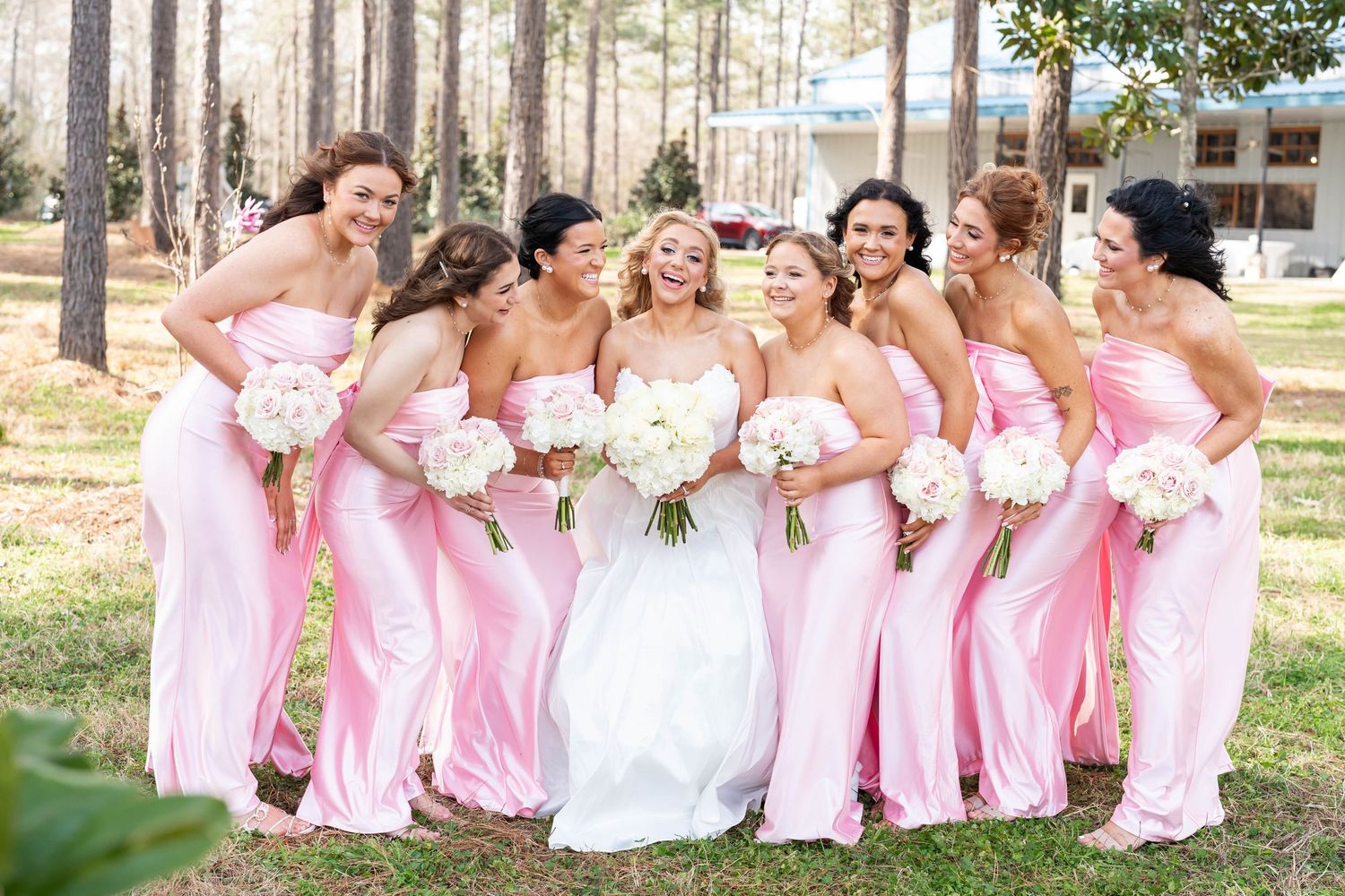 bridesmaids in pink dresses with the bride