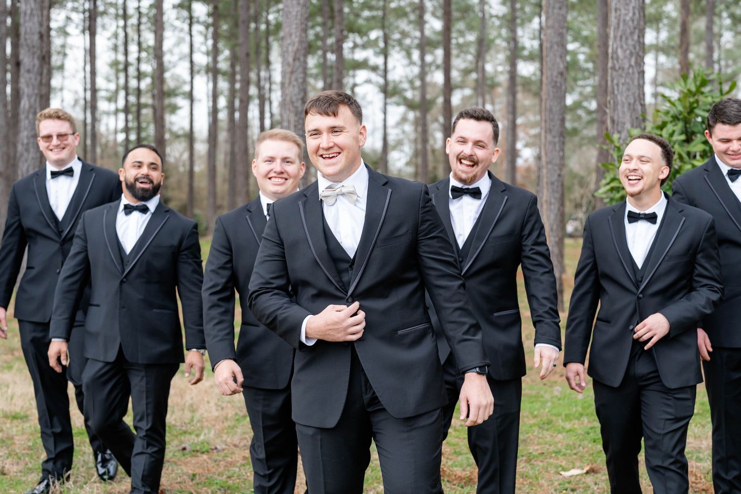 groom laughing with groomsmen