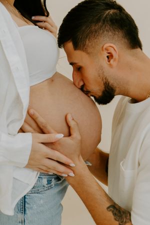 Artistic photo series showing intimate close-up shots of a couple in white against a light background.