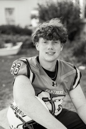 Black and white portrait series of Panthers football player in uniform.