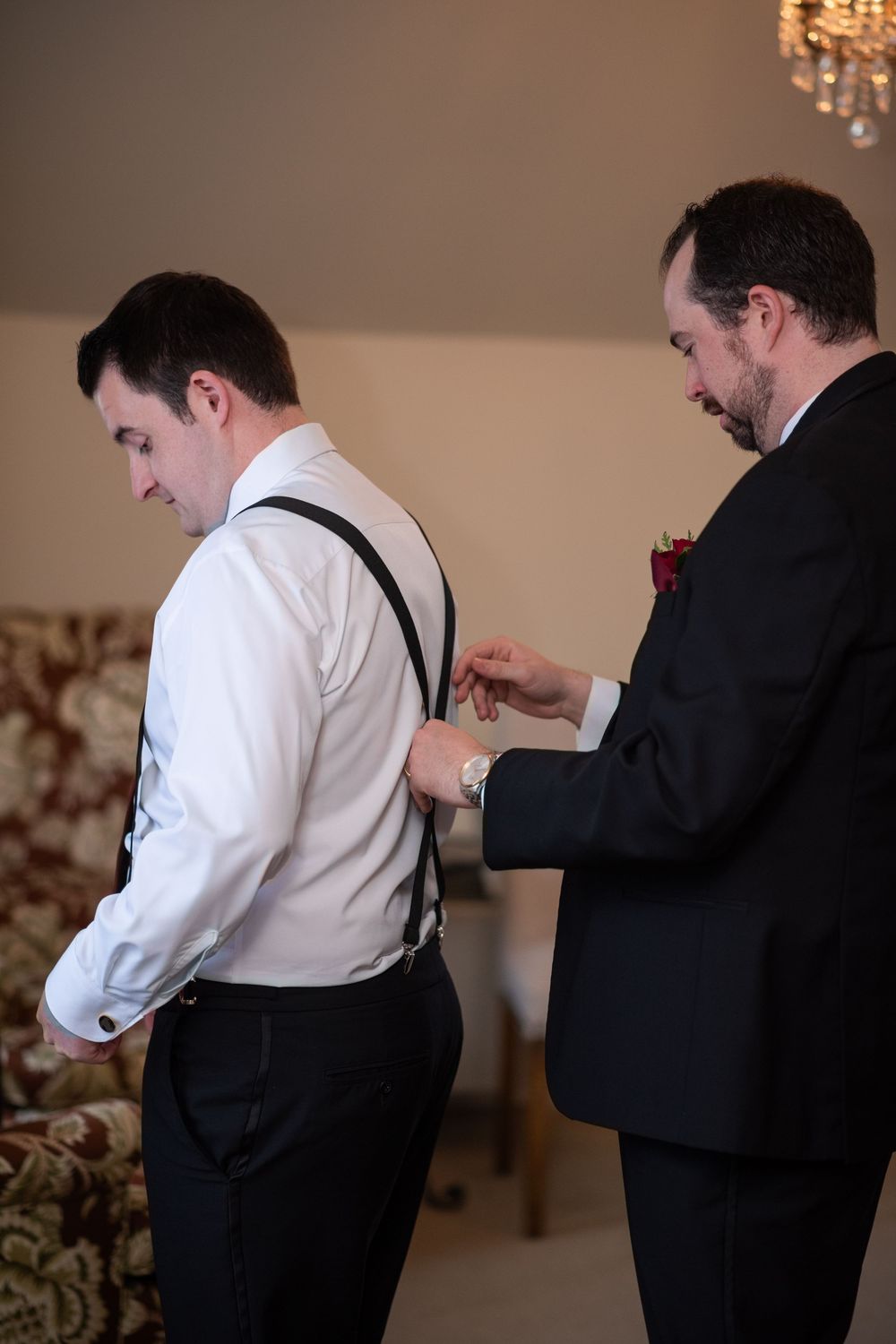 A series of photos showing someone helping another person adjust their suspenders before a formal event.