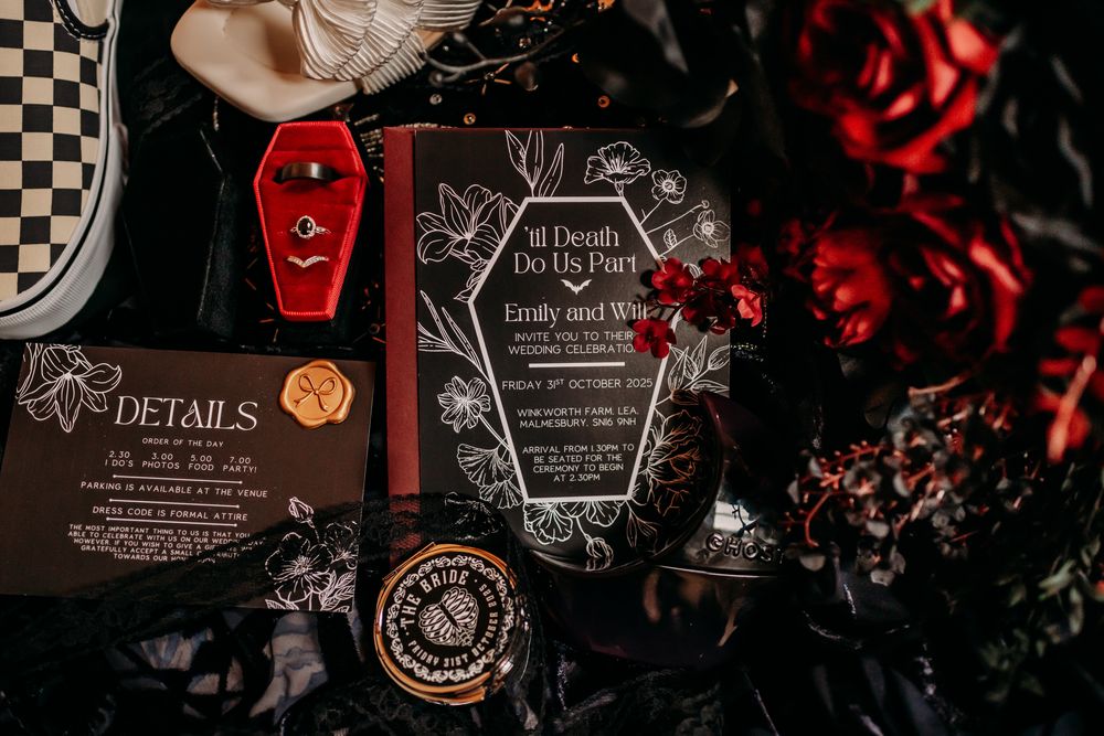 Trophy awards displayed in a row with dark dramatic lighting and red accents in the background.