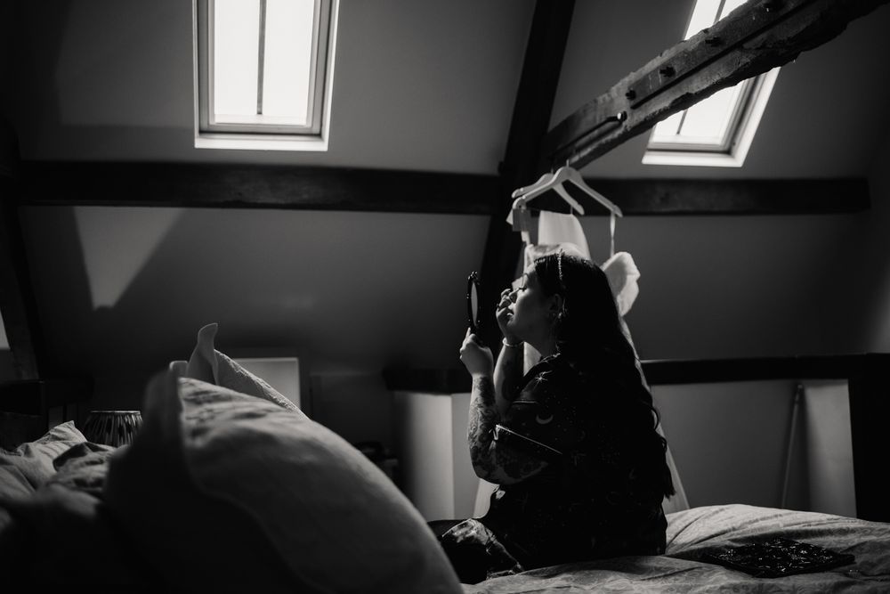 A black and white photo montage showing interior spaces with dramatic lighting and shadows.
