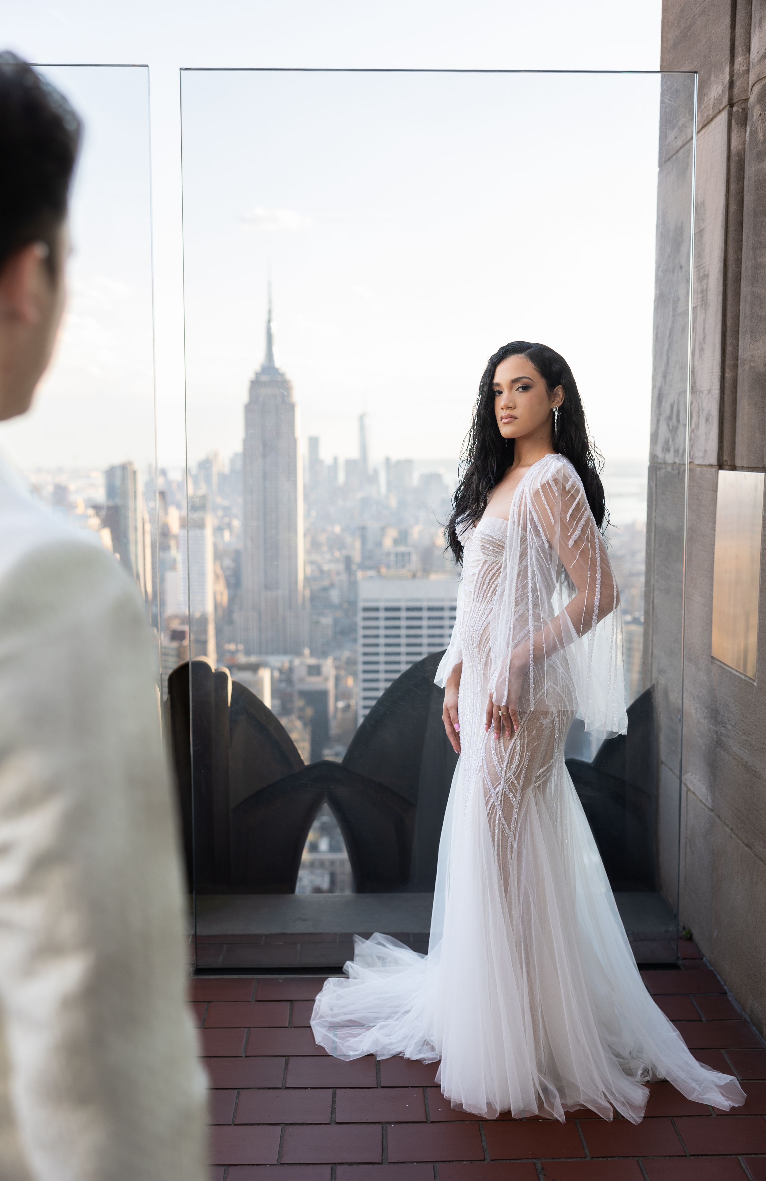 Elegant bridal portrait on NYC rooftop with Empire State Building in backdrop.