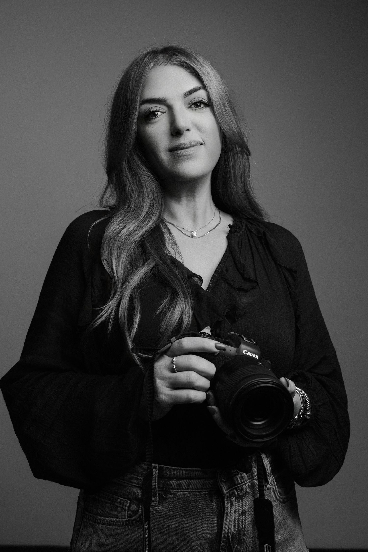 Professional headshot of elzhbetta k, photographer, captured in a studio setting