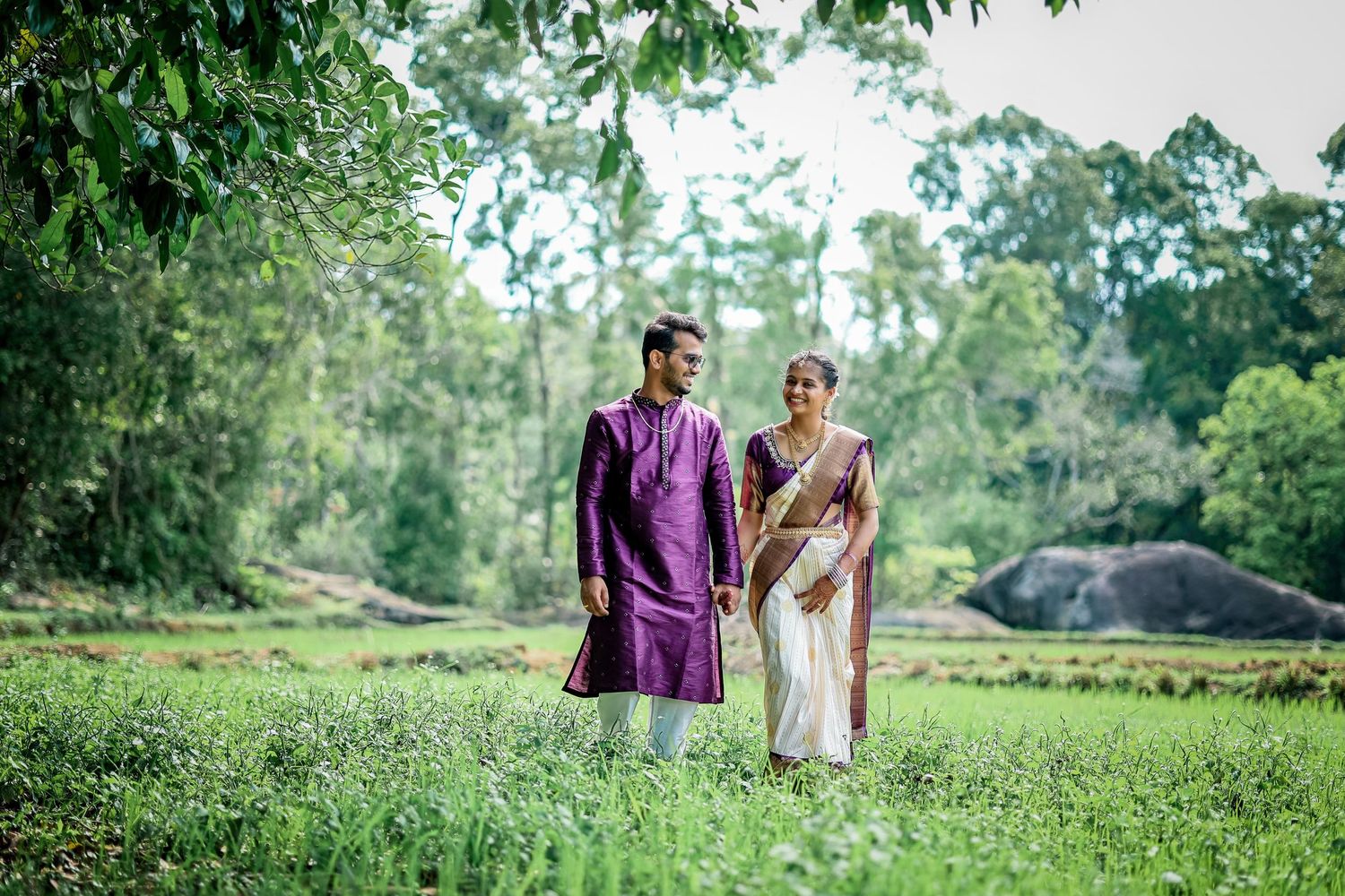 Couple in traditional Indian attire during an outdoor wedding photoshoot