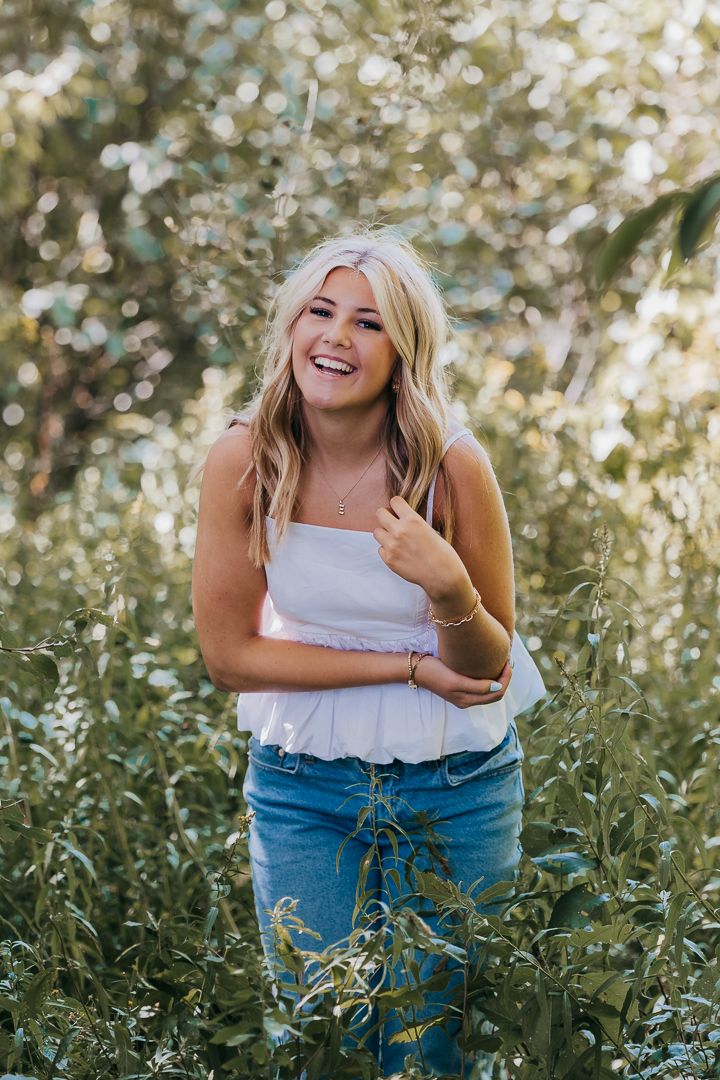 A candid series of joyful moments captured in a lush green garden setting with natural sunlight filtering through.